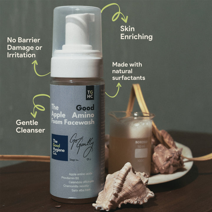 Foam face wash bottle with blue label on a white background